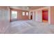 Large main bedroom features three windows, plush carpet, and walk-in closets at 4921 Lazy Day Ct, Las Vegas, NV 89131