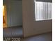 Bedroom featuring natural light from the window, a closet, and neutral carpeting at 5158 S Jones Blvd # 107, Las Vegas, NV 89118