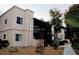 Two-story apartment building with a red tiled roof, side stairs, and desert landscaping at 5158 S Jones Blvd # 107, Las Vegas, NV 89118
