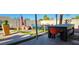 Outdoor living space including dining, seating, and grilling area at 5318 Palmyra Ave, Las Vegas, NV 89146