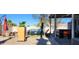 Landscaped backyard featuring an outdoor dining area, mature trees, and a patio at 5318 Palmyra Ave, Las Vegas, NV 89146