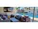 Cozy outdoor seating area overlooking a sparkling pool and lush backyard, perfect for relaxation and entertainment at 5318 Palmyra Ave, Las Vegas, NV 89146