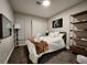 Comfortable bedroom features a large window, closet, a full-sized bed, and simple decor at 5318 Palmyra Ave, Las Vegas, NV 89146
