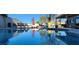 Backyard pool reflects a serene outdoor space with lounge chairs, dining area, and lush greenery at 5318 Palmyra Ave, Las Vegas, NV 89146