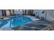 Sparkling pool with a diving board, and lounge chairs, surrounded by lush landscaping and privacy fencing at 5318 Palmyra Ave, Las Vegas, NV 89146