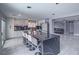 Spacious kitchen featuring a black marble island, white cabinets, and modern appliances at 5364 Awbury Ave, Las Vegas, NV 89110