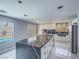 Bright kitchen showcasing a large center island and view of the backyard pool at 5364 Awbury Ave, Las Vegas, NV 89110