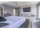 This spacious main bedroom offers a decorative fireplace, sleek floors, and a large flat screen TV at 5364 Awbury Ave, Las Vegas, NV 89110