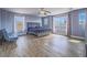 The oversized main bedroom features beautiful wood floors and neutral paint throughout at 5364 Awbury Ave, Las Vegas, NV 89110