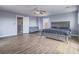This neutral main bedroom offers ample space, wood-style floors, and a comfortable bed at 5364 Awbury Ave, Las Vegas, NV 89110