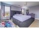 Cozy main bedroom showcasing a large platform bed and light hardwood floors at 5364 Awbury Ave, Las Vegas, NV 89110