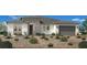 Charming single-story home with stone accents, well-manicured desert landscaping, and a two car garage at 5715 Golden Chase Ct, Las Vegas, NV 89131