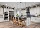 Modern kitchen with stainless steel appliances, a center island with bar stools, and sleek countertops at 5715 Golden Chase Ct, Las Vegas, NV 89131