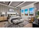 Serene main bedroom with a stylish accent wall, large windows, and neutral decor at 5715 Golden Chase Ct, Las Vegas, NV 89131
