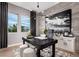 Modern office space featuring stone accent wall, contemporary lighting, large windows and stylish décor at 5715 Golden Chase Ct, Las Vegas, NV 89131