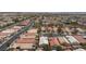 Expansive aerial view of a well-planned residential community with neatly arranged homes and tree-lined streets at 6133 Alderley Ct, North Las Vegas, NV 89081