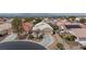 Aerial view of a single-Gathering home with a two-car garage and nearby solar panels at 6133 Alderley Ct, North Las Vegas, NV 89081