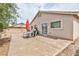 Backyard patio with table, chairs, and grill perfect for outdoor entertaining at 6133 Alderley Ct, North Las Vegas, NV 89081