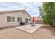 Backyard patio with table, chairs, and grill perfect for outdoor entertaining at 6133 Alderley Ct, North Las Vegas, NV 89081