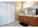 Bathroom featuring dual sinks, marble countertops, and modern fixtures at 6133 Alderley Ct, North Las Vegas, NV 89081