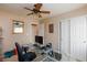 This bedroom features a glass desk and direct access to an ensuite bathroom and closet at 6133 Alderley Ct, North Las Vegas, NV 89081