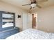 This bedroom features neutral walls, a ceiling fan, and an ensuite bathroom and closet at 6133 Alderley Ct, North Las Vegas, NV 89081