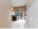 Cozy kitchen features tile flooring, light wood cabinets, and stainless steel appliances at 6133 Alderley Ct, North Las Vegas, NV 89081