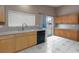 Bright kitchen with stainless steel appliances and oak cabinets at 6133 Alderley Ct, North Las Vegas, NV 89081