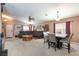 Spacious living room dining room combo with carpet and furniture at 6133 Alderley Ct, North Las Vegas, NV 89081
