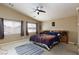 A spacious main bedroom with natural light and a ceiling fan provides comfort at 6133 Alderley Ct, North Las Vegas, NV 89081