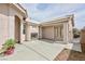 Covered outdoor patio featuring a fireplace, tile roof, and stucco wall at 6133 Alderley Ct, North Las Vegas, NV 89081