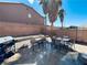 Enclosed backyard with patio, rock landscaping and privacy wall perfect for relaxing or entertaining at 6297 Peach Orchard Rd, Las Vegas, NV 89142