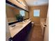 Bathroom featuring double sinks, a large mirror, and a separate bathtub and shower at 6297 Peach Orchard Rd, Las Vegas, NV 89142
