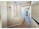 Second story hallway featuring carpet flooring, built-in shelving, and a view of a bedroom at 6297 Peach Orchard Rd, Las Vegas, NV 89142