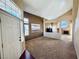 Open floor plan with vaulted ceilings and fireplace in a neutrally painted home at 6297 Peach Orchard Rd, Las Vegas, NV 89142