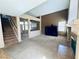 Spacious living room with vaulted ceilings and fireplace with staircase in view at 6297 Peach Orchard Rd, Las Vegas, NV 89142