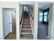 Carpeted staircase leading to the second floor of a neutrally painted home at 6297 Peach Orchard Rd, Las Vegas, NV 89142