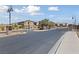 Gated community entrance with brick pillars, manicured landscaping, and secure access at 6403 Dundock Ave, Las Vegas, NV 89122