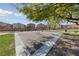 Serene park with mature shade trees and a playground structure, providing a peaceful recreation space at 6403 Dundock Ave, Las Vegas, NV 89122