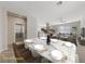 Bright dining area showcasing a sleek marble table set for an elegant meal at 6403 Dundock Ave, Las Vegas, NV 89122