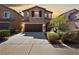 Charming two-story home featuring a two-car garage, manicured landscaping, and a welcoming curb appeal at 6403 Dundock Ave, Las Vegas, NV 89122