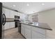 Kitchen with granite counters, a center island, and stainless steel appliances at 6403 Dundock Ave, Las Vegas, NV 89122