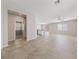 An expansive living area features neutral walls, ceramic tile floors, and recessed lighting at 6403 Dundock Ave, Las Vegas, NV 89122