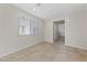 Neutral living area features ceramic tile floors and lots of natural light at 6403 Dundock Ave, Las Vegas, NV 89122