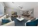 Comfortable living room with a ceiling fan and plush sofa near the dining area at 6403 Dundock Ave, Las Vegas, NV 89122