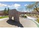Outdoor play area features a climbing structure, splash pad, and walking path, providing a dynamic recreational space at 6403 Dundock Ave, Las Vegas, NV 89122