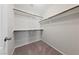 Walk-in closet with carpet flooring and white shelving, ideal for organization and storage at 6403 Dundock Ave, Las Vegas, NV 89122