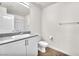This bathroom has a single sink with granite countertops and a shower at 6952 Crimson Shadow St, North Las Vegas, NV 89086