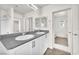 This bathroom has dual sinks with granite countertops and a shower in the next room at 6952 Crimson Shadow St, North Las Vegas, NV 89086