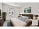 Stylishly staged bedroom with modern furniture and decor at 6952 Crimson Shadow St, North Las Vegas, NV 89086